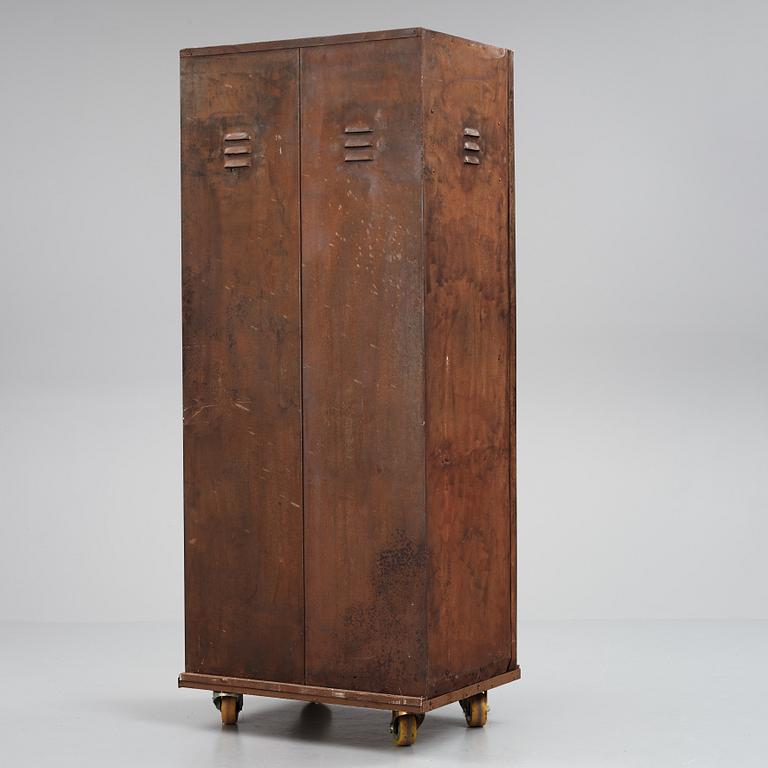 A 20th century patinated metal changing room cabinet.