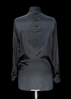 A black silk lace blouse by Yves saint Laurent.