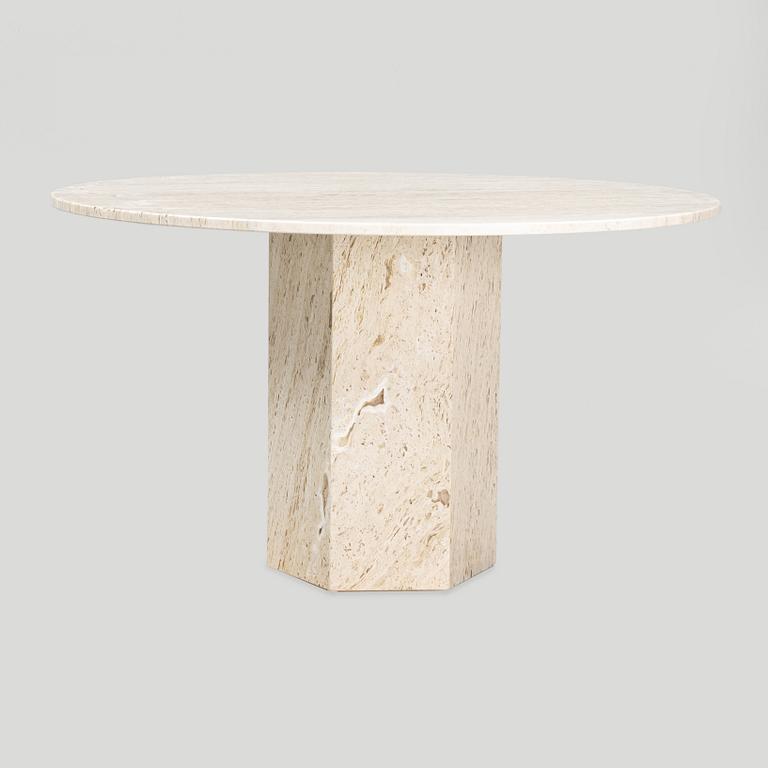 A travertine  'Epic Dining Table' from Gubi.