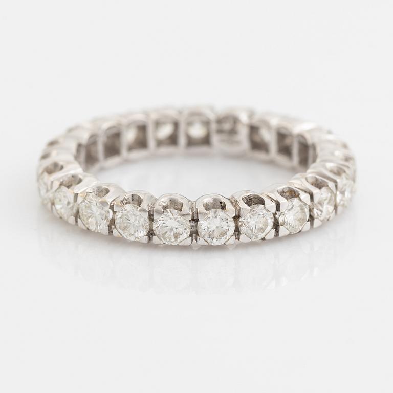 Brilliant cut diamond eternity ring.