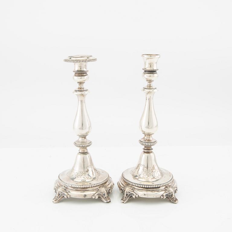 A 20th century set of two pairs of silver candle sticks different makers 1870/80s.