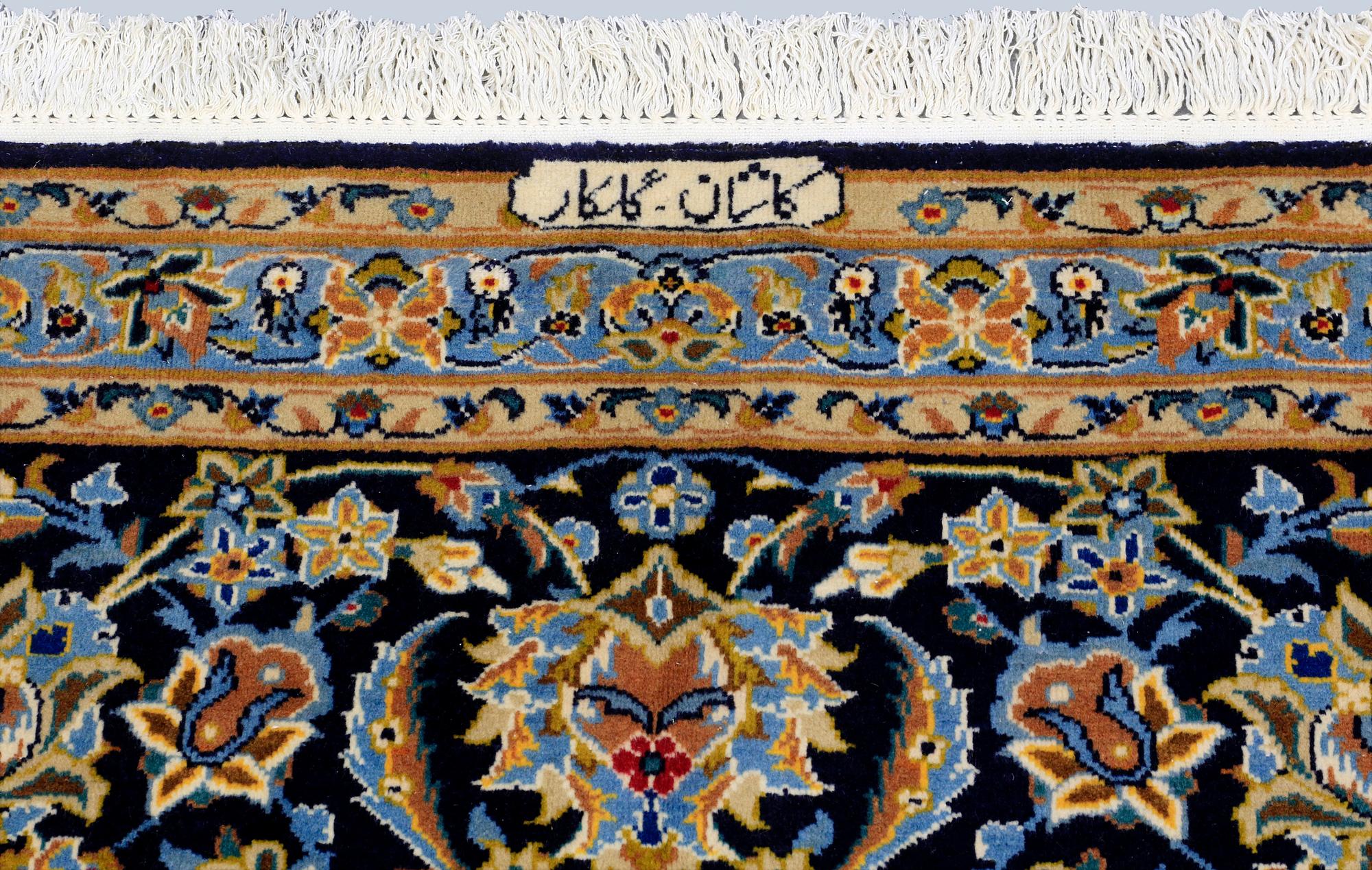 A Keshan carpet, signed, approx. 600 x 400 cm.