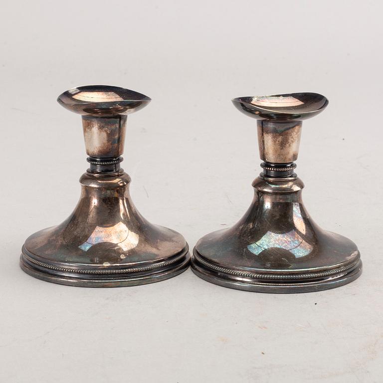 A set of three pair of Swedish 20th century silver candle sticks.