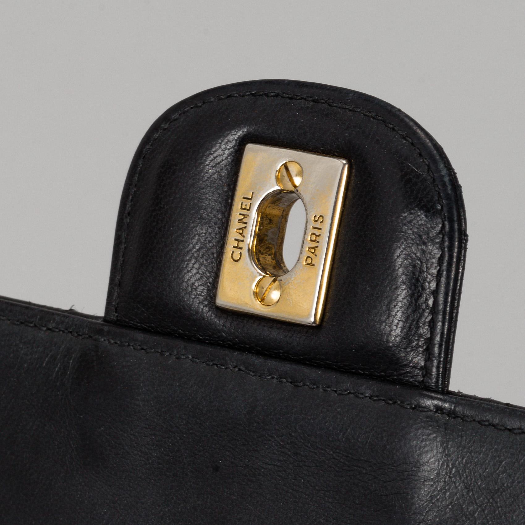 CHANEL, a quilted black leather 'Double Flap Bag'.