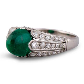 107. A RING, cabochon cut emerald, old cut diamonds. Alexander Tillander, St Petersburg 1855-1918.