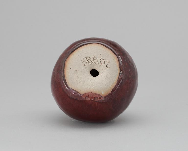 An Ulla Kraitz ceramic apple.