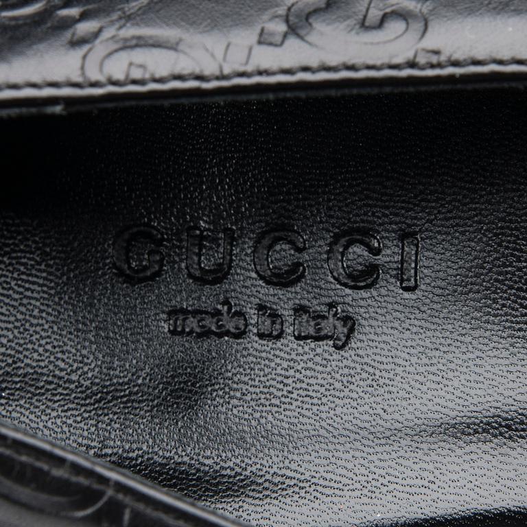 SKOR, Gucci.