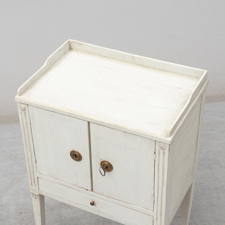 A later part of the 19th century Gustavian style bedside cabinet.