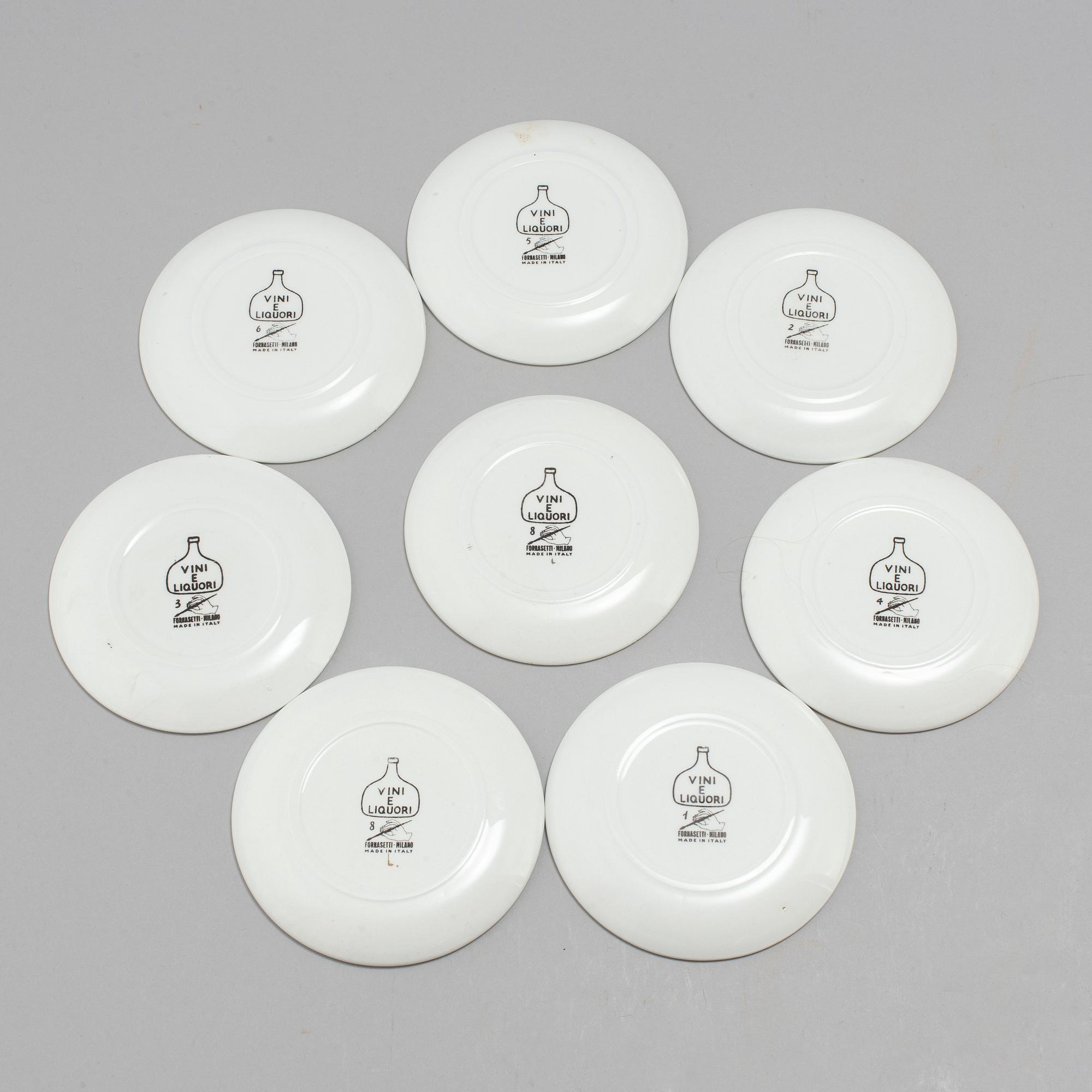 Eight porcelain coasters, Fornasetti, Milan, Italy.
