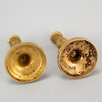 A pair of Louis XVI style candlesticks. Ca 1900.