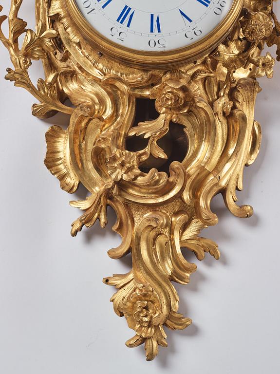 A French Louis XV gilt bronze clock marked Balthazard Paris.