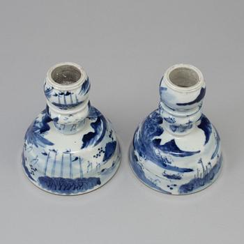 A pair of blue and white candlesticks, late Qingdynasty.