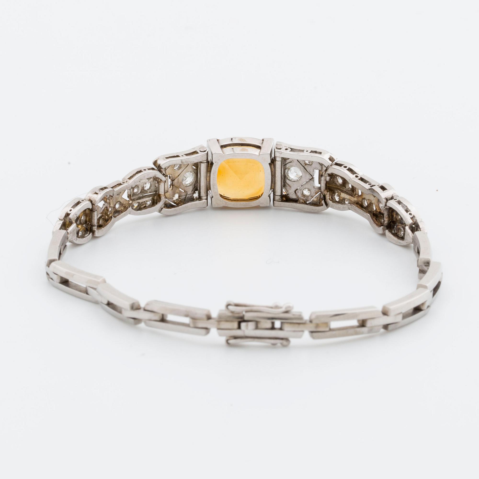 BRACELET platinum and 18K whitegold, 1 citrine, 2 old-cut and 8/8-cut diamonds approx 0,80 ct, G  Dahlgren & Co Malmö.
