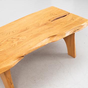 A sold elm coffee table, Söwe Konst, Sweden, dated 1977.