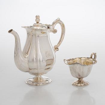 A silver coffee pot, sugar bowl, cream jug, and sugar tongs, Finland 1926-49.