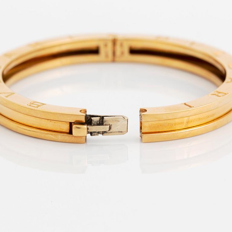 An 18K gold Bulgari bangle.