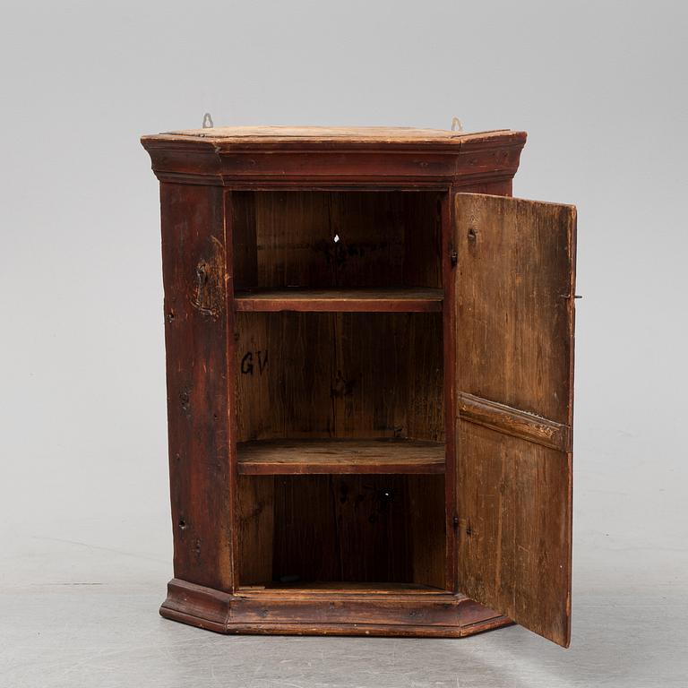A Swedish painted corner cabinet, 19th century.