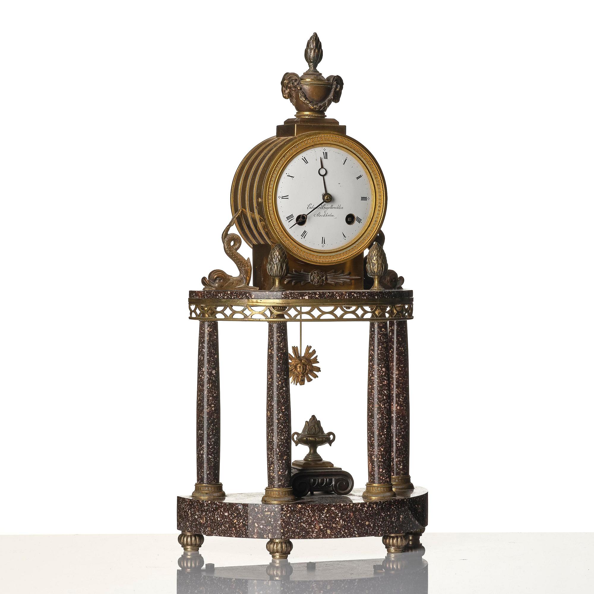 A late Gustavian-style porphyry portico clock.