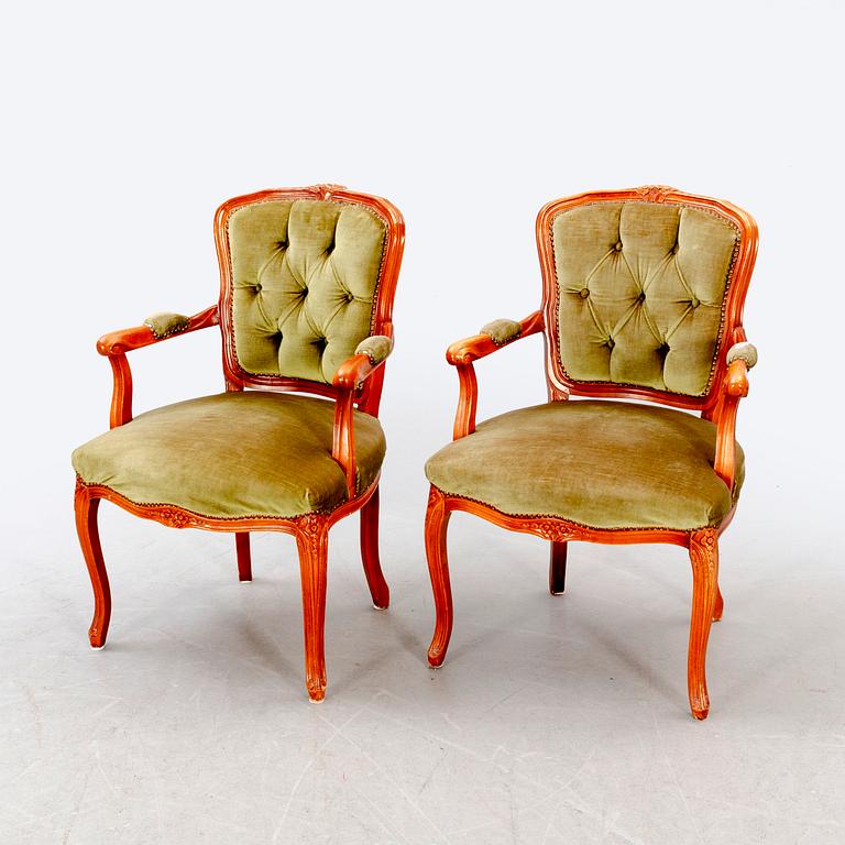 A pair of Rococo-style mid 1900s armchairs.