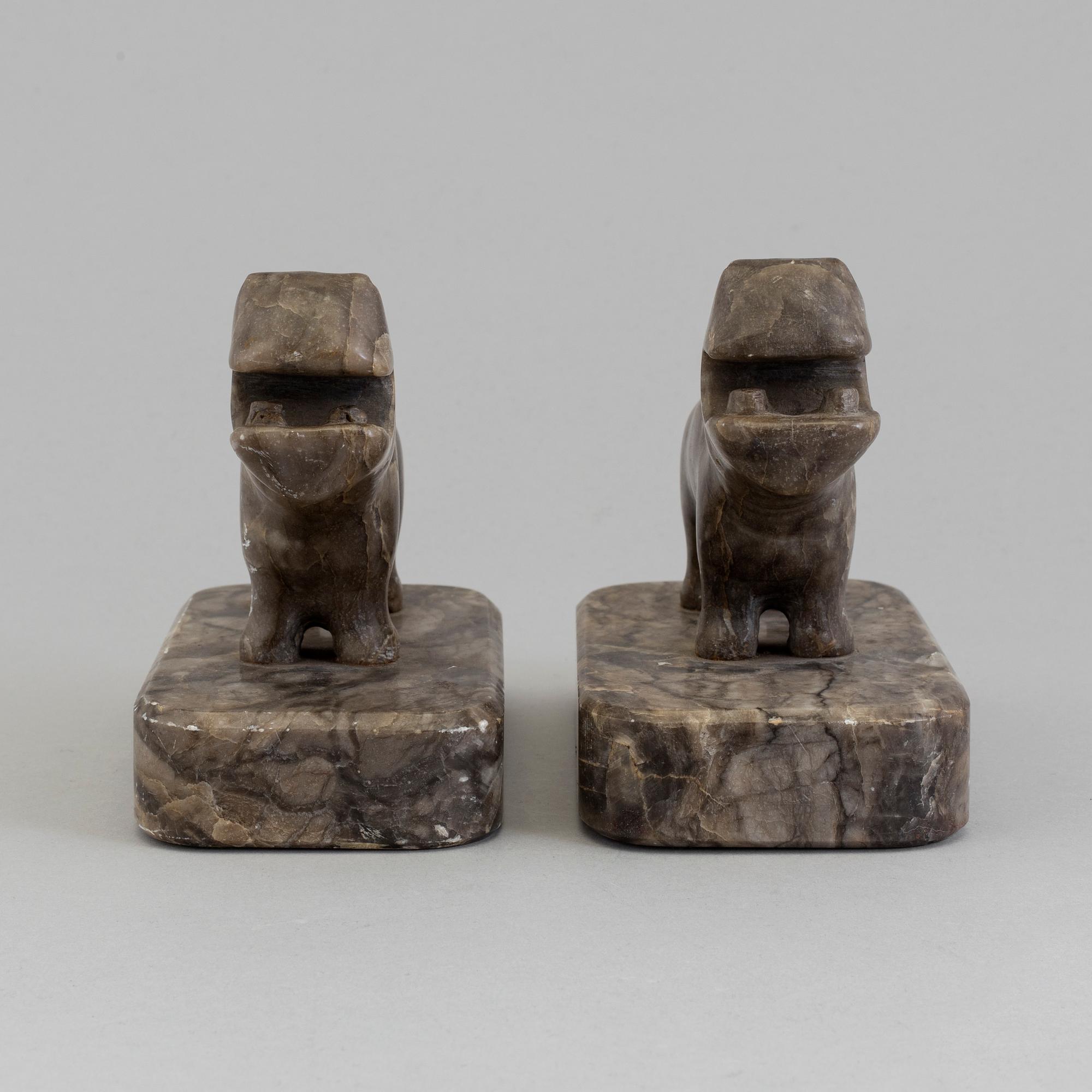 A pair of stone book ends, early 20th century.