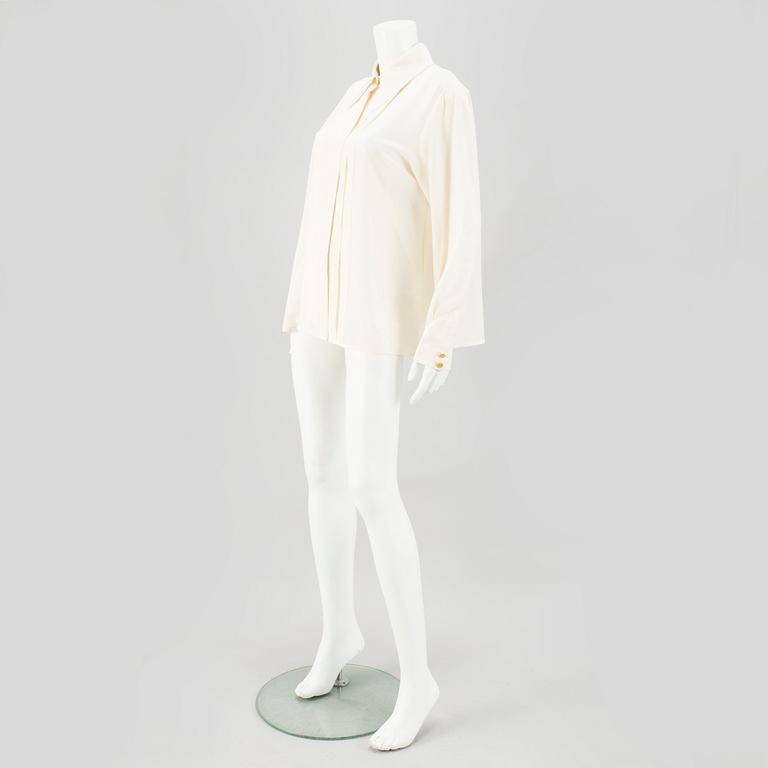 A Crepe de Chine Cream Coloured Silk Blouse by Chanel.