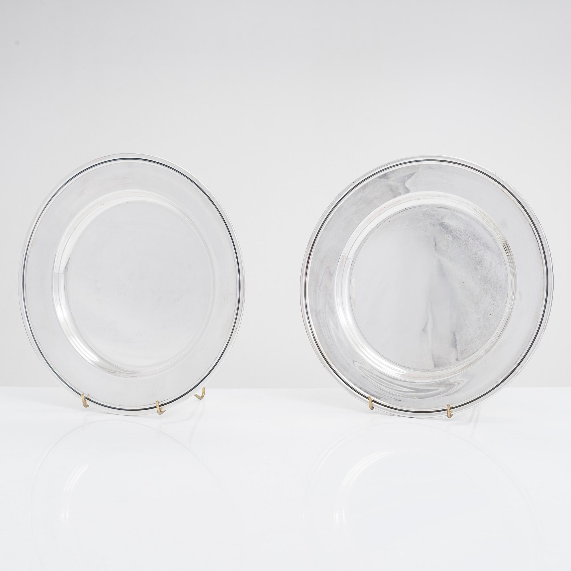 A 12-piece set of silver chargers, makers' marks of Hugo Grün, S.H. Jörgensen..., Denmark, around mid-20th century.