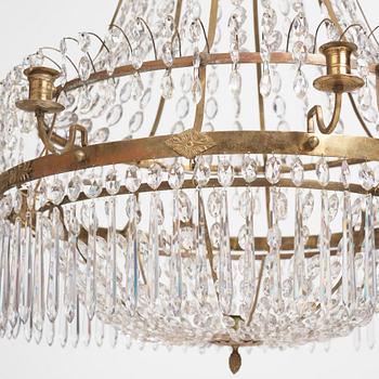 A late Gustavian nine-light gilt brass and cut glass chandelier, Stockholm, late 18th century.