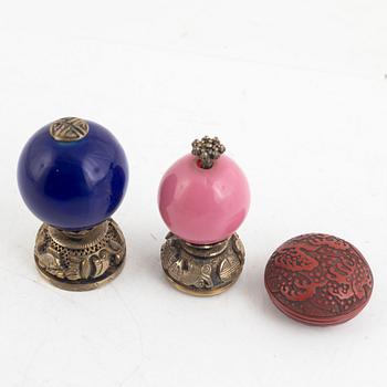 Two Chinese hat finials / mandarin insignias and a red lacquer box / button, late Qing dynasty.