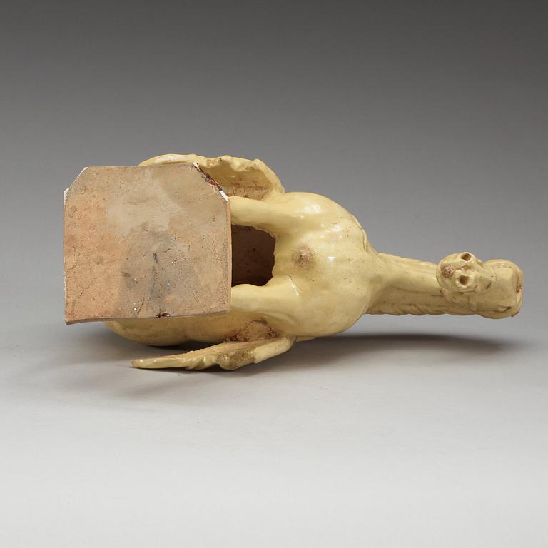 A yellow glazed pottery figure of a horze, presumably Tang dynasty (618-907).