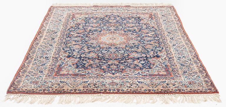 A semi-antique Isfahan rug, signed (Sadegh) Seirafian, c. 244 x 149 cm.