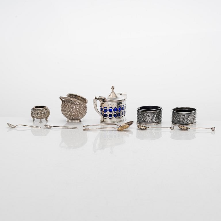 A silver mustard pot and spoon, salt cellars and salt spoons, totally 11 pieces, late 19th century - 20th century.