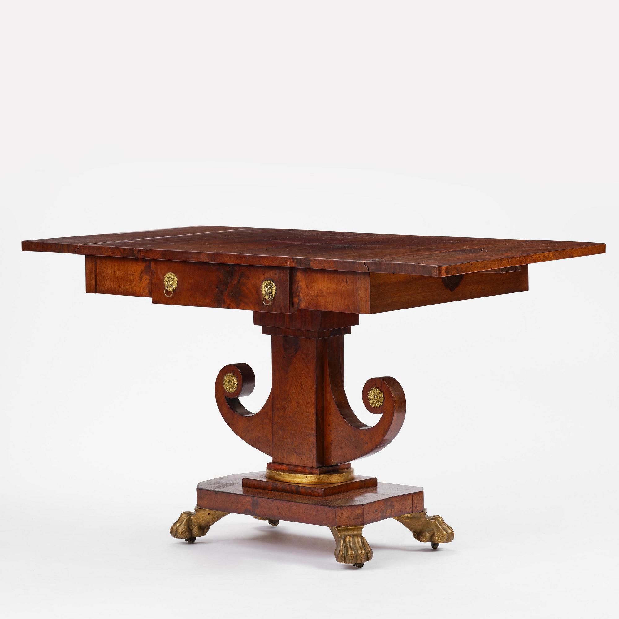 A Swedish Empire mahogany center table.