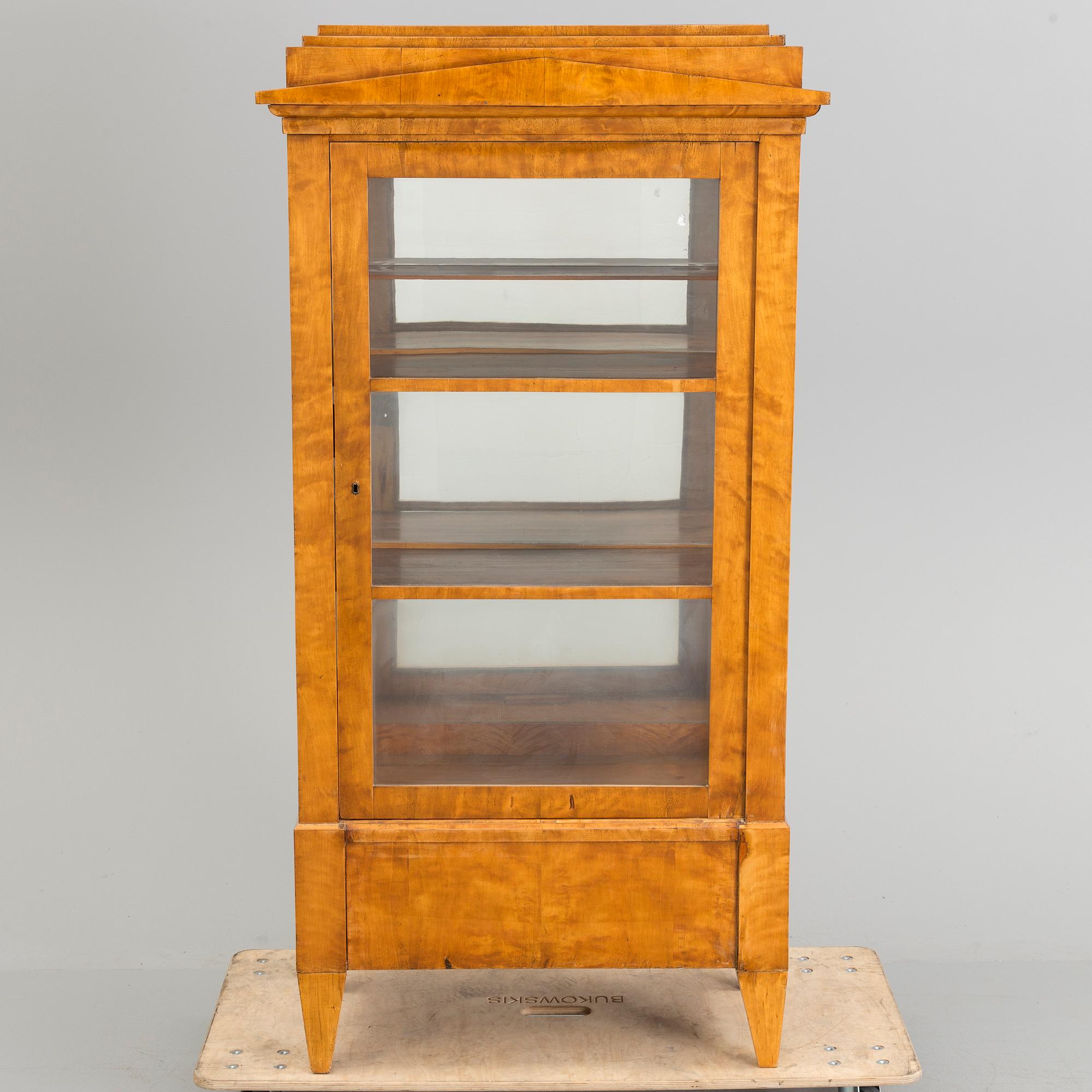 A Swedish first half of the 19th century display cabinet veneered with birch.