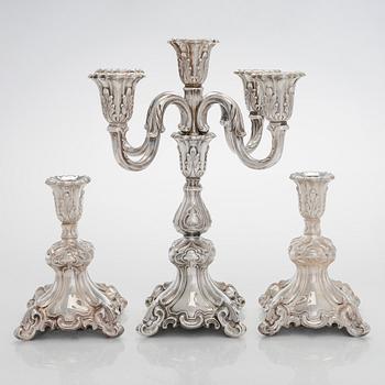 A 5-candle silver candelabra and a pair of candlesticks, silver, Auran Kultaseppä, Turku 1984.