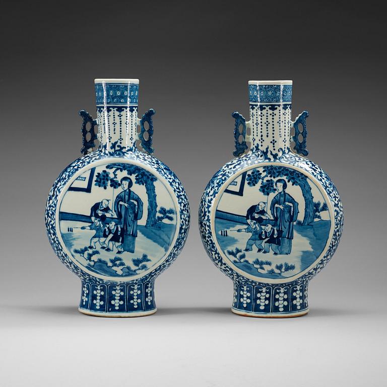 A pair of large blue and white moon flasks, late Qing dynasty (1644-1912), with Kangxi four character mark.