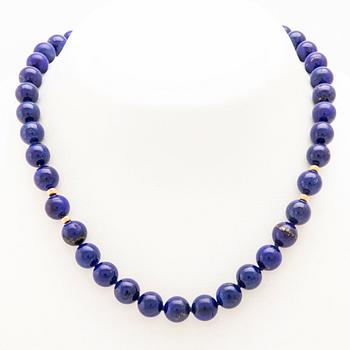 Necklace with an 18K gold clasp and Lapis Lazuli beads.