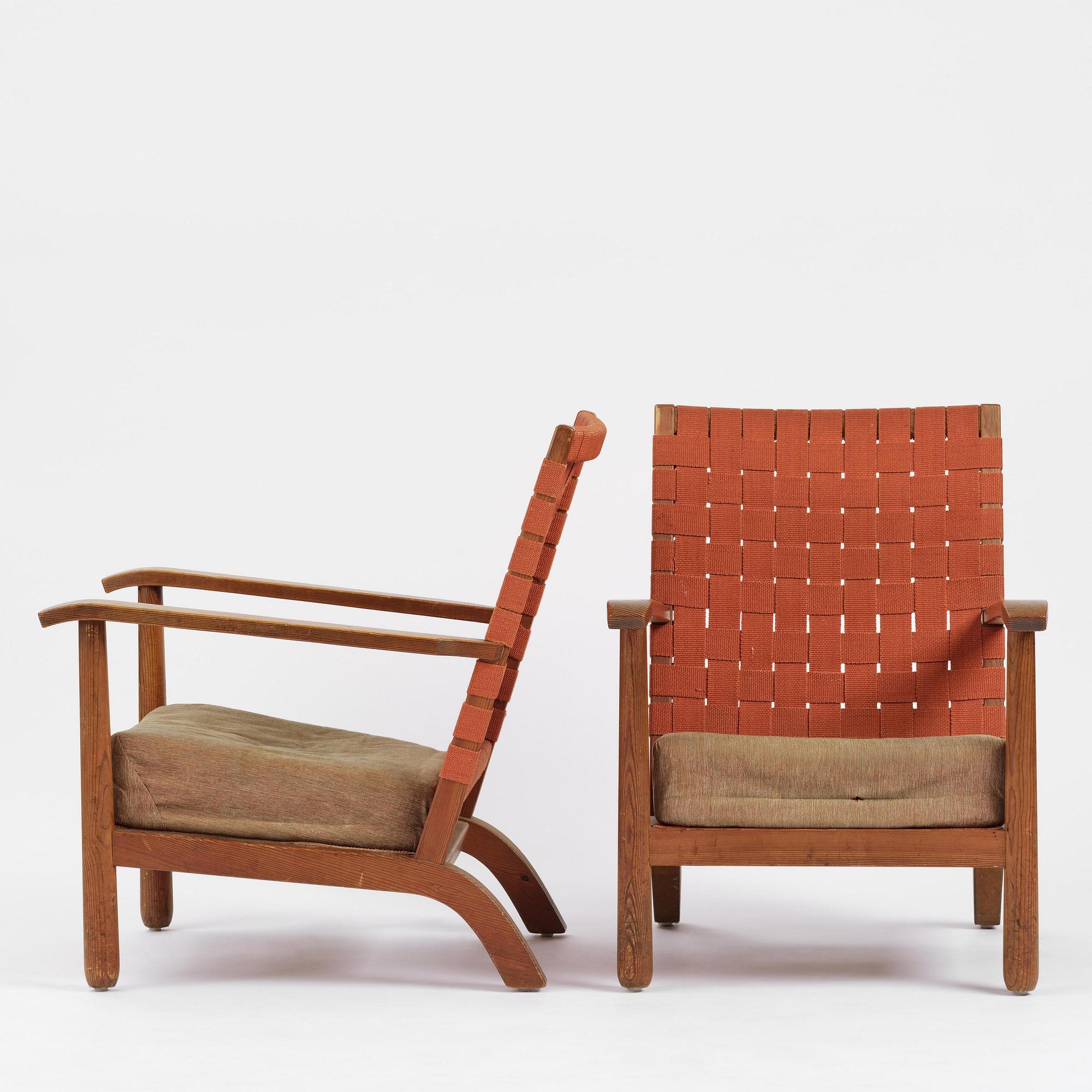 Axel Einar Hjorth, a pair of stained pine "Väddö" easy chairs, Nordiska Kompaniet, Sweden, 1930s-40s.