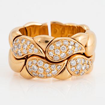 1107. A Chopard "Casmir" ring in 18K gold set with round brilliant-cut diamonds.