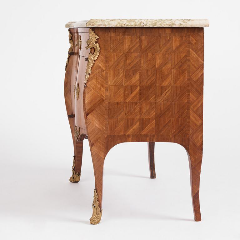 A Swedish rococo parquetry and ormolu-mounted commode, later part of the 18th century.