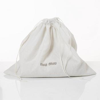 Miu Miu, a handbag.