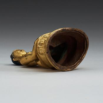 A gilt bronze figure of buddha, Presumably Tibet, 18th Century or older.