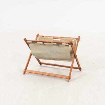 A 1950/60s teak newspaper holder.