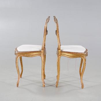 A pair of chairs from the first half of the 20th century.