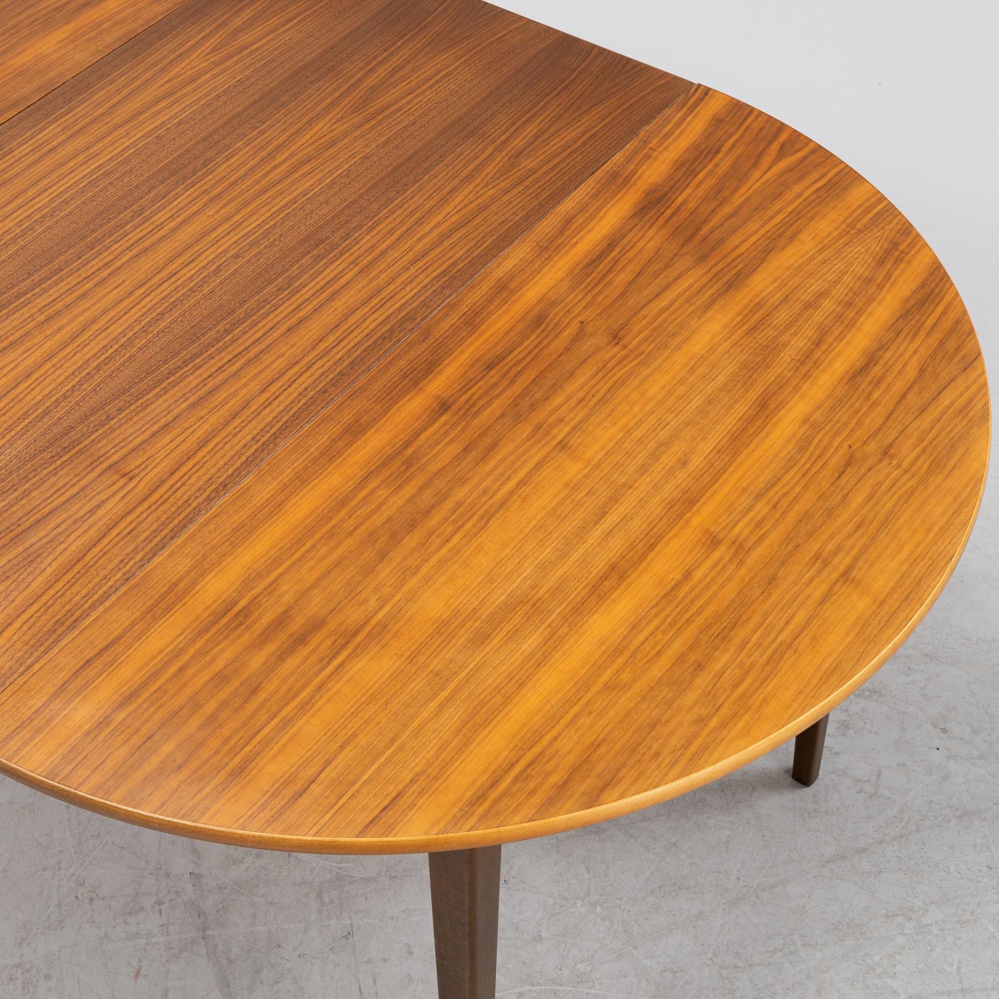 A walnut dining table, 1960's.