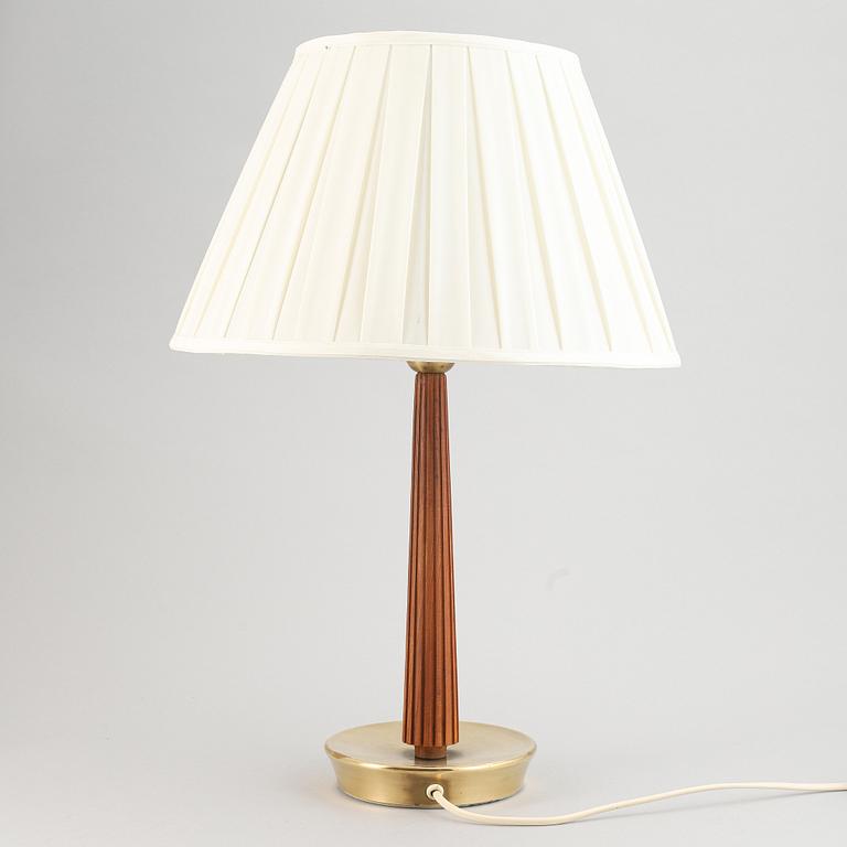 A brass and oak table light by Hans Bergström for ASEA, mid 20th Century.