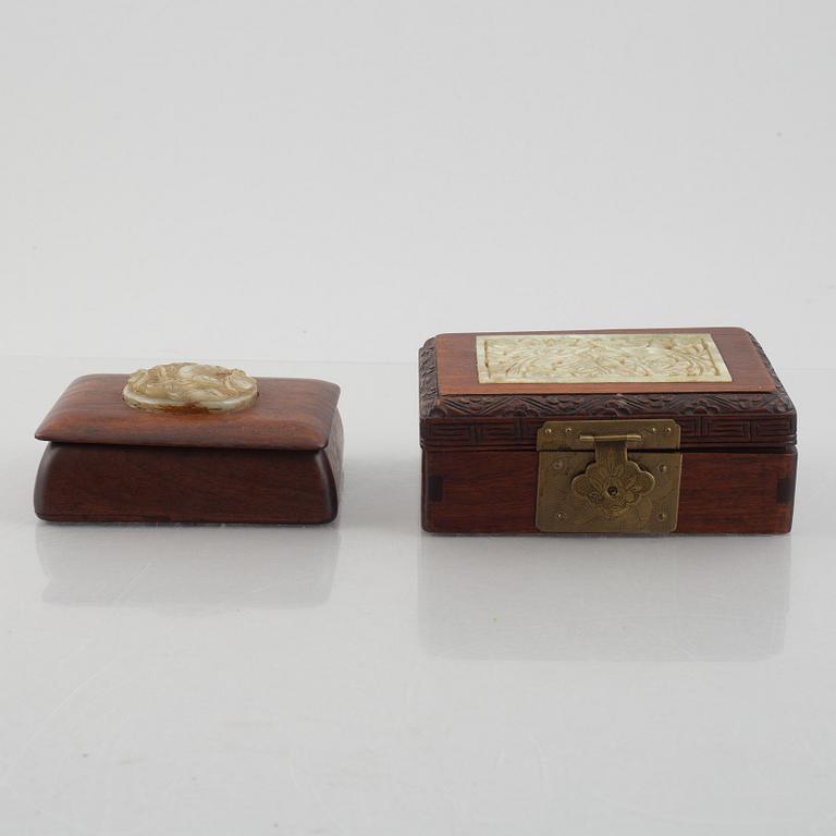Two Chinese hardwood boxes with nephrite plaques, 20th century.