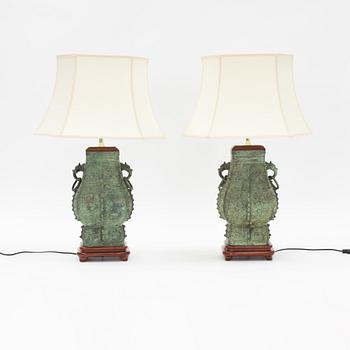 A pair of archaistic bronze vases made in to lamps, China, 20th Century.