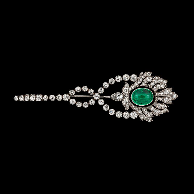 A cabochon-cut emerald and diamond brooch. Total carat weight of diamonds circa 3.80 cts.