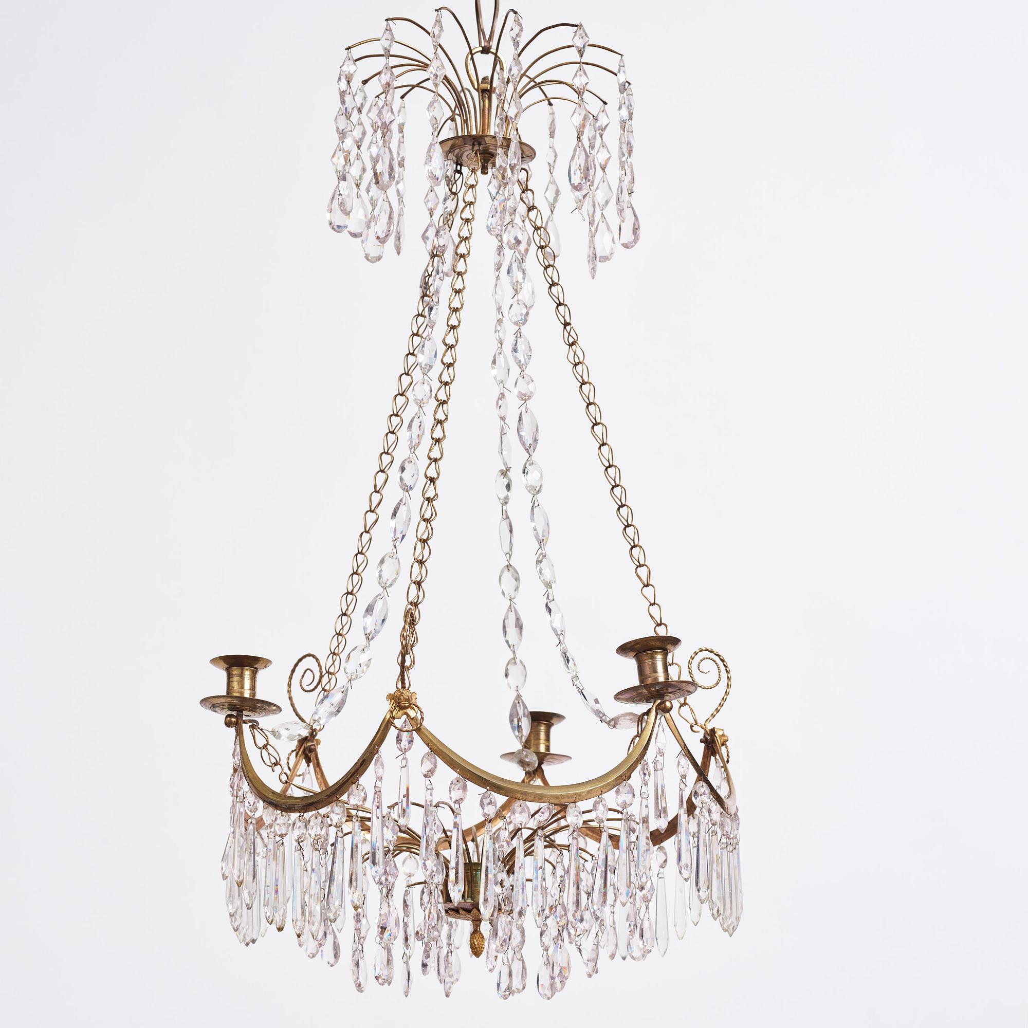 A Gustavian gilt brass and cut glass four-light chandelier, Stockholm, late 18th century.