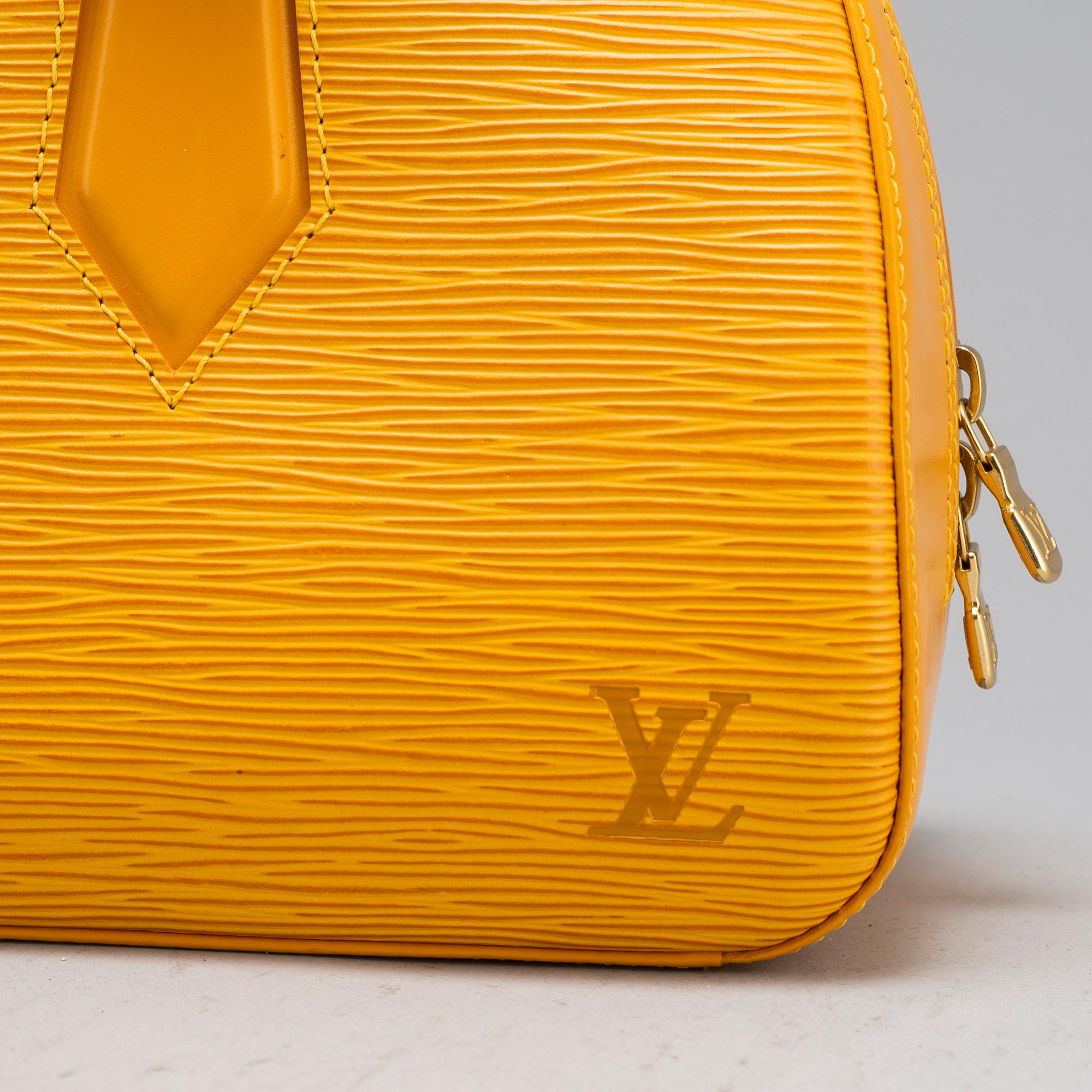 LOUIS VUITTON a yellow epi leather Jasmine handbag. Bukowskis